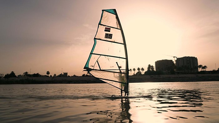 Members of the Iraqi national windsurfing team train in the Tigris River for the Arab. sailing Championships in Baghdad, Iraq, Saturday, May 14, 2022. (AP Photo/Hadi Mizban)