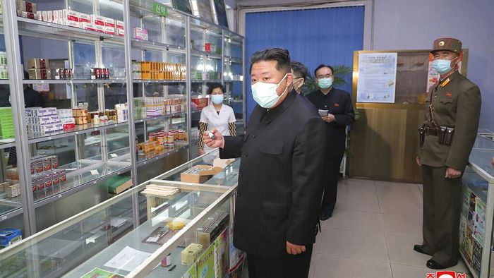 In this photo provided by the North Korean government, North Korean leader Kim Jong Un, center, visits a pharmacy in Pyongyang, North Korea Sunday, May 15, 2022. Independent journalists were not given access to cover the event depicted in this image distributed by the North Korean government. The content of this image is as provided and cannot be independently verified.   Korean language watermark on image as provided by source reads: 