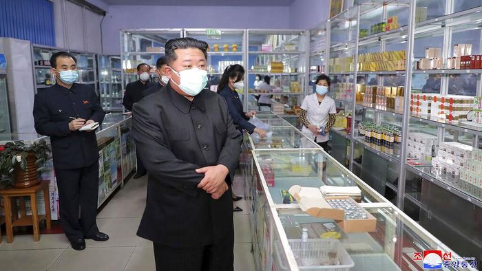 In this photo provided by the North Korean government, North Korean leader Kim Jong Un, center, visits a pharmacy in Pyongyang, North Korea Sunday, May 15, 2022. Independent journalists were not given access to cover the event depicted in this image distributed by the North Korean government. The content of this image is as provided and cannot be independently verified.   Korean language watermark on image as provided by source reads: 