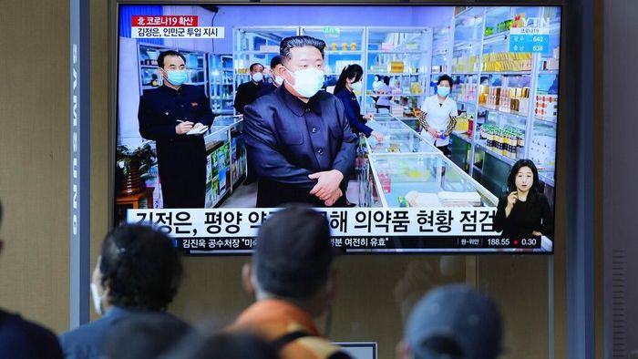 People watch a TV screen showing a news program reporting with an image of North Korean leader Kim Jong Un, at a train station in Seoul, South Korea, Monday, May 16, 2022. Kim  blasted officials over slow medicine deliveries and ordered his military to respond to the surging but largely undiagnosed COVID-19 crisis that has left 1.2 million people ill with fever and 50 dead in a matter of days, state media said Monday. (AP Photo/Lee Jin-man)