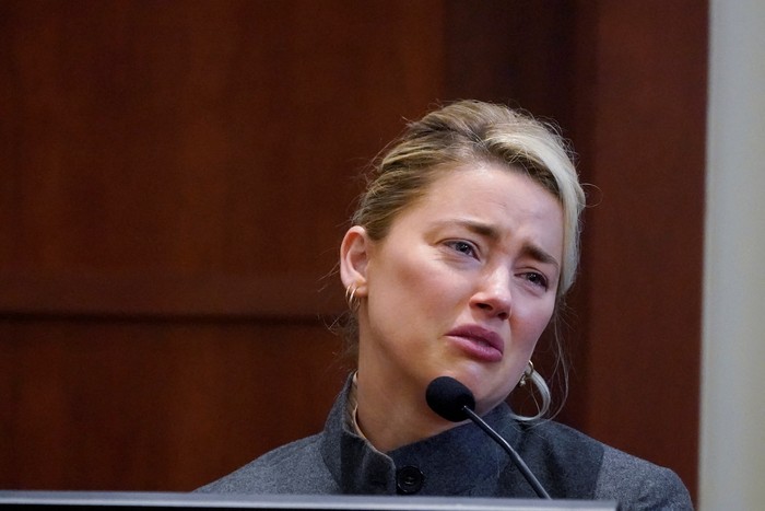 Actor Amber Heard testifies in the courtroom at the Fairfax County Circuit Courthouse in Fairfax, Va., Monday, May 16, 2022.  Steve Helber/Pool via REUTERS