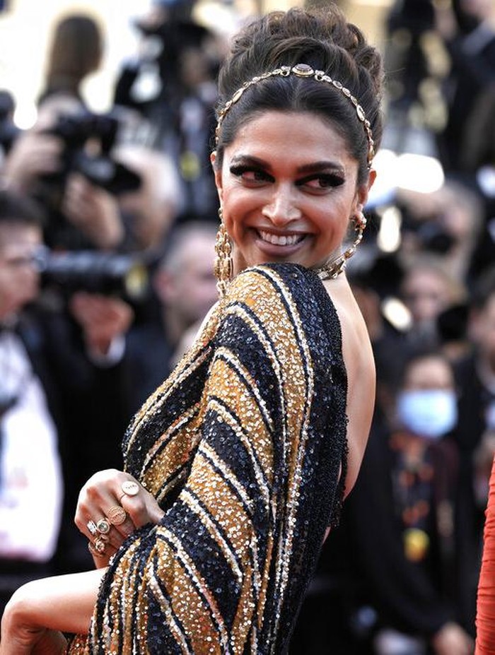 Jury member Deepika Padukone poses for photographers upon arrival at the opening ceremony and the premiere of the film 'Final Cut' at the 75th international film festival, Cannes, southern France, Tuesday, May 17, 2021. (AP Photo/Petros Giannakouris)