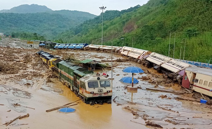 Train coaches are seen toppled over following mudslides triggered by heavy rains at New Haflong railway station on the Lumding-Silchar route at Dima Hasao district, in northeastern Assam state, India, Tuesday, May 16, 2022. (AP Photo)