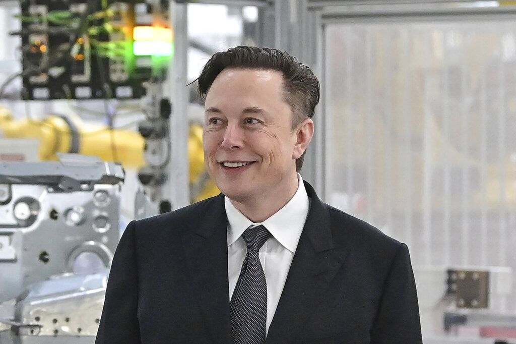 FILE - Tesla CEO Elon Musk attends the opening of the Tesla factory Berlin Brandenburg in Gruenheide, Germany on March 22, 2022. Musk says his deal to buy Twitter can't 'move forward' unless the company shows public proof that less than 5% of the accounts on the platform are fake or spam. Musk made the comment in a reply to another user on Twitter early Tuesday, May 17, 2022. (Patrick Pleul/Pool Photo via AP, File)