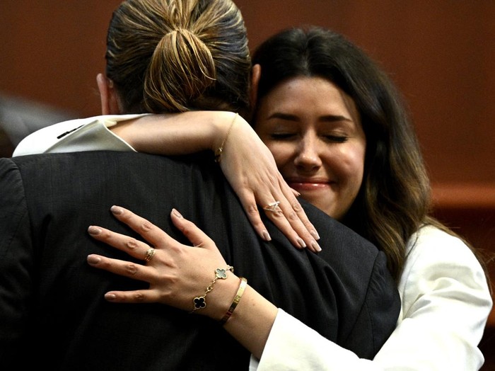 1239937338 US Attorney Camille Vasquez (C) arrives during the $50 million Depp vs Heard defamation trial at the Fairfax County Circuit Court in Fairfax, Virginia, on April 12, 2022. (Photo by Brendan Smialowski / POOL / AFP) (Photo by BRENDAN SMIALOWSKI/POOL/AFP via Getty Images)