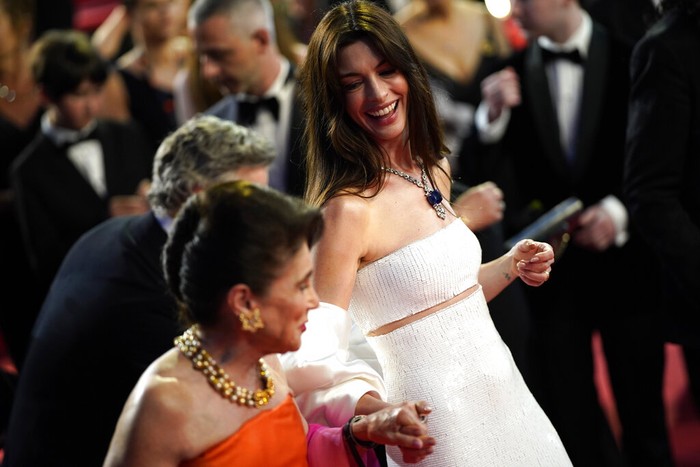 Anne Hathaway departs after the premiere of the film 'Armageddon Time' at the 75th international film festival, Cannes, southern France, Thursday, May 19, 2022. (AP Photo/Daniel Cole)
