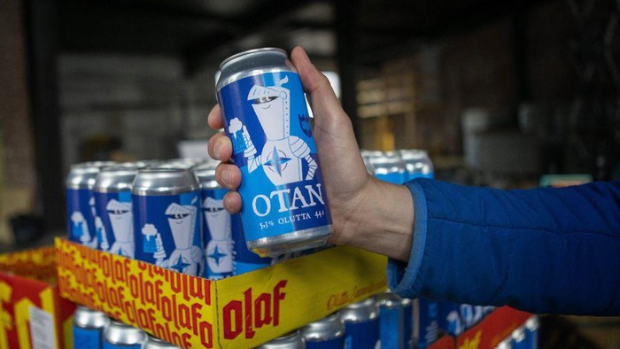 A hand holds a Nato-branded OTAN beer can produced by the Olaf Brewing Company in Savonlinna, eastern Finland, on May 17, 2022. - Finland OUT (Photo by Soila Puurtinen / LEHTIKUVA / AFP) / Finland OUT (Photo by SOILA PUURTINEN/LEHTIKUVA/AFP via Getty Images)