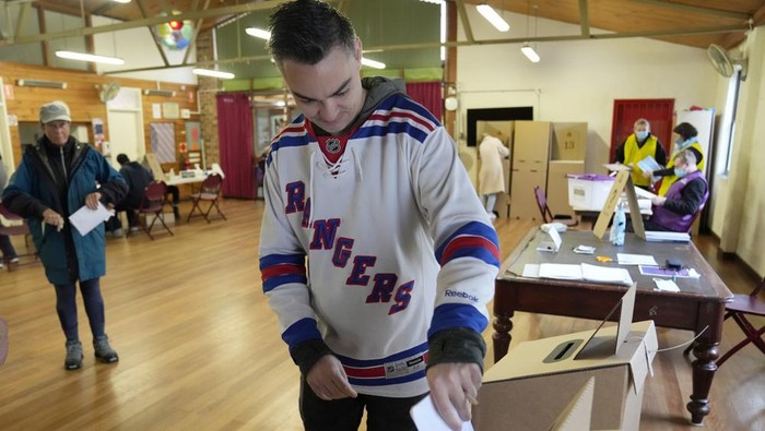 A man casts his ballot at an inner Sydney polling station, Australia, Saturday, May 21, 2022. Australians go to the polls following a six-week election campaign that has focused on pandemic-fueled inflation, climate change and fears of a Chinese military outpost being established less than 1,200 miles off Australias shore. (AP Photo/Rick Rycroft)