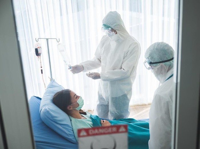 coronavirus COVID-19 virus patient having fever, epidemic, doctor and nurse in uniform working medicine care at hospital to protection prevention and vaccination quarantine technology