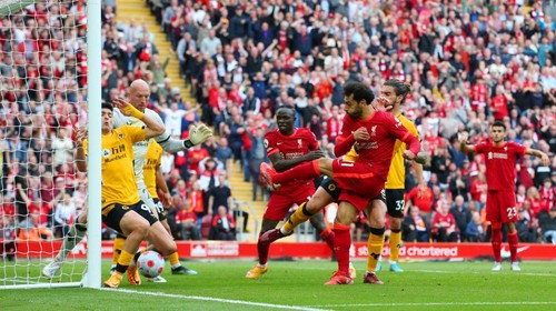 LIVERPOOL, ENGLAND - MAY 22: Mohamed Salah of Liverpool scores their sides second goal during the Premier League match between Liverpool and Wolverhampton Wanderers at Anfield on May 22, 2022 in Liverpool, England. (Photo by Alex Livesey/Getty Images)