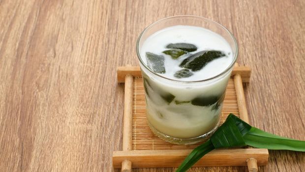 Es Cincau Hijau (green grass jelly), a traditional Indonesian dessert. Made from cincau, coconut milk and palm sugar. Selected focus.