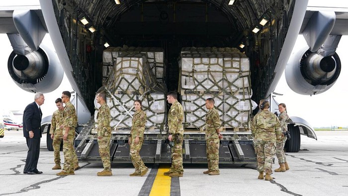 Pallets of baby formula are transfered to a truck after arriving on an Air Force C-17 at the Indianapolis International Airport in Indianapolis, Sunday, May 22, 2022. The 132 pallets of Nestlé Health Science Alfamino Infant and Alfamino Junior formula arrived from Ramstein Air Base in Germany. (AP Photo/Michael Conroy)