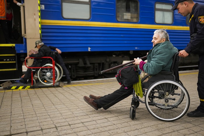 Russia Ukraine War Lyubov Chudnyk, right, fleeing from heavy shelling, waits aboard an evacuation train to depart Pokrovsk train station, in Pokrovsk, eastern Ukraine, Sunday, May 22, 2022. Civilians fleeing areas near the eastern front in the war in Ukraine Sunday described scenes of devastation as their towns and villages came under sustained attack from Russian forces. (AP Photo/Francisco Seco)