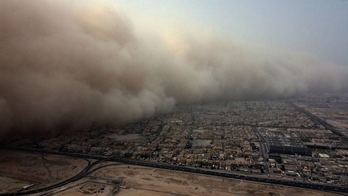 This picture taken on May 23, 2022 shows an aerial view of a massive dust storm advancing into Kuwait City above Kuwait University Campus. (Photo by YASSER AL-ZAYYAT / AFP) (Photo by YASSER AL-ZAYYAT/AFP via Getty Images)