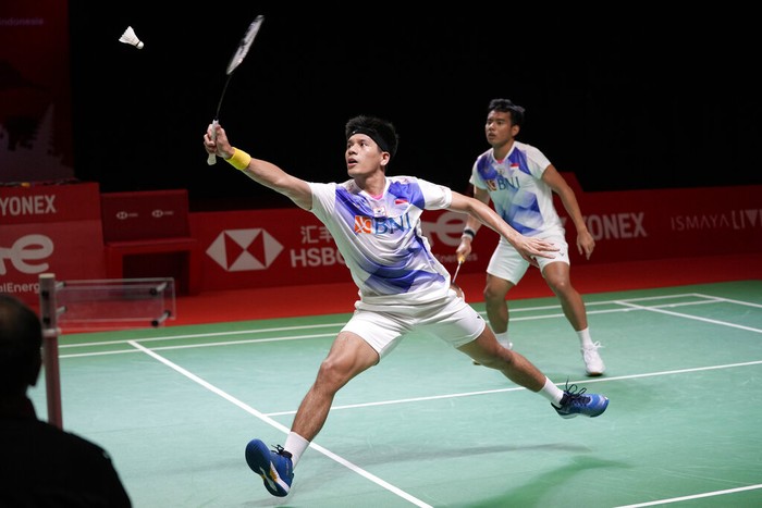 Indonesias Yeremia Rambitan, front, and Pramudya Kusumawardana compete against Christo Popov and Toma Junior Popov of France during their mens doubles badminton group stage match at the BWF World Tour Finals in Nusa Dua, Bali, Indonesia, Friday, Dec. 3, 2021. (AP Photo/Dita Alangkara)