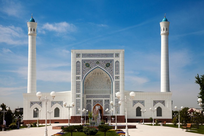 View of a beautiful white mosque with minarets in Tashkent in summer. 04.29.2019