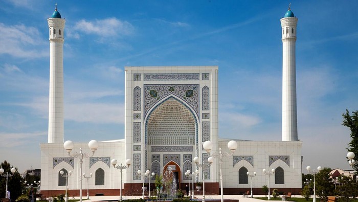 View of a beautiful white mosque with minarets in Tashkent in summer. 04.29.2019