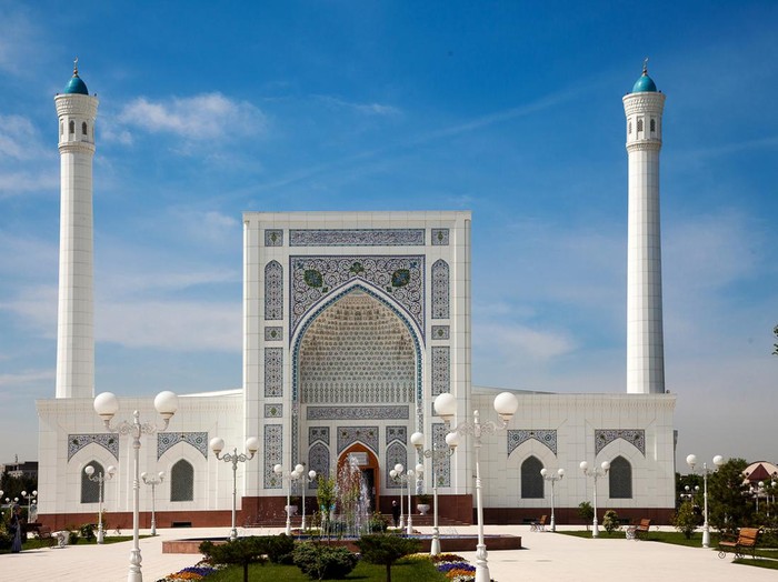View of a beautiful white mosque with minarets in Tashkent in summer. 04.29.2019