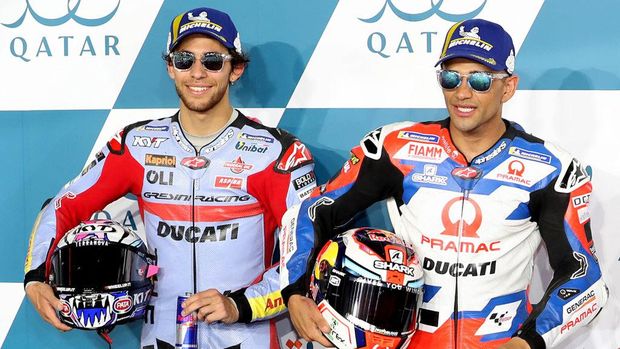 Second-place Gresini Racing MotoGP team's Italian rider Enea Bastianini (L) and first-place Pramac Racing's Spanish rider Jorge Martin celebrate on the podium following the second qualifying session ahead of the Moto GP Grand Prix of Qatar at the Lusail International Circuit, in the city of Lusail on March 5, 2022. (Photo by DENOUR / AFP) (Photo by DENOUR/AFP via Getty Images)