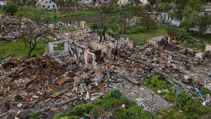 1240921553 NOVOSELIVKA, UKRAINE - MAY 26: Oleksandr, 43, disassembles the roof of his destroyed house on May 26, 2022 in Novoselivka, Ukraine. Chernihiv, northeast of Kyiv, was an early target of Russia's offensive after its February 24 invasion. While they failed to capture the city, Russian forces battered large parts of Chernihiv and the surrounding region in their attempted advance toward the capital. (Photo by Alexey Furman/Getty Images)