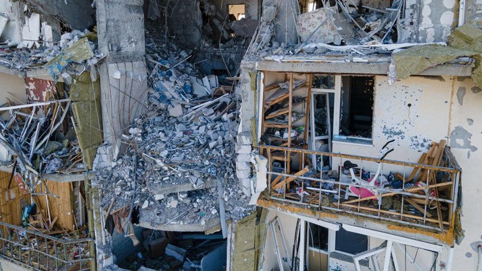 NOVOSELIVKA, UKRAINE - MAY 26: Oleksandr, 43, disassembles the roof of his destroyed house on May 26, 2022 in Novoselivka, Ukraine. Chernihiv, northeast of Kyiv, was an early target of Russias offensive after its February 24 invasion. While they failed to capture the city, Russian forces battered large parts of Chernihiv and the surrounding region in their attempted advance toward the capital. (Photo by Alexey Furman/Getty Images)