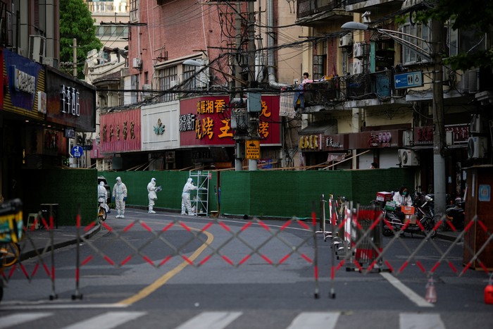 A man rides a bicycle at a main shopping area during lockdown, amid the coronavirus disease (COVID-19) pandemic, in Shanghai, China, May 26, 2022. REUTERS/Aly Song