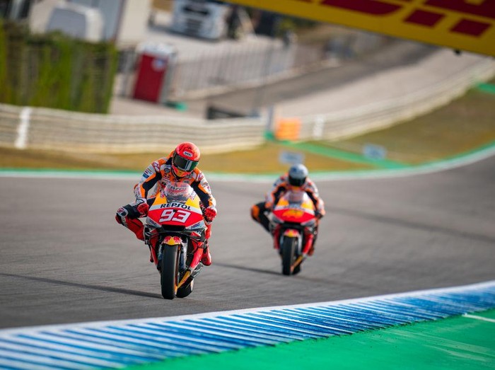 LOMBOK, INDONESIA - FEBRUARY 10: Marc Marquez of Spain and Repsol Honda Team and Pol Espargaro of Spain and Repsol Honda Team ride scooters around the circuit during the MotoGP Pre-Season IRTA-Test at Mandalika International Street Circuit on February 10, 2022 in Lombok, Indonesia. (Photo by Steve Wobser/Getty Images)