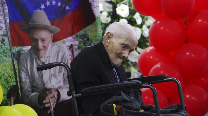 Venezuela Oldest Man Juan Vicente PΓ©rez Mora, who is listed by Guinness World Records as the oldest living male in the world, attends a Mass as part of celebration of his 113th birthday in San Jose De Bolivar in Tachira State in Venezuela, Friday, May 27, 2022. (AP Photo/Gilberto Chacon)