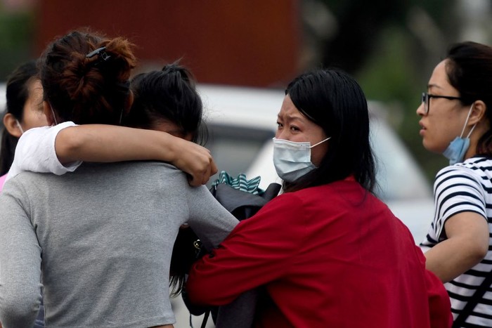 1240978425 Family members and relatives of passengers on board the Twin Otter aircraft operated by Tara Air, weep outside the airport in Pokhara on May 29, 2022. - A passenger plane with 22 people on board went missing in Nepal on May 29, the operating airline and officials said, as poor weather hampered a search operation. (Photo by PRAKASH MATHEMA / AFP) (Photo by PRAKASH MATHEMA/AFP via Getty Images)