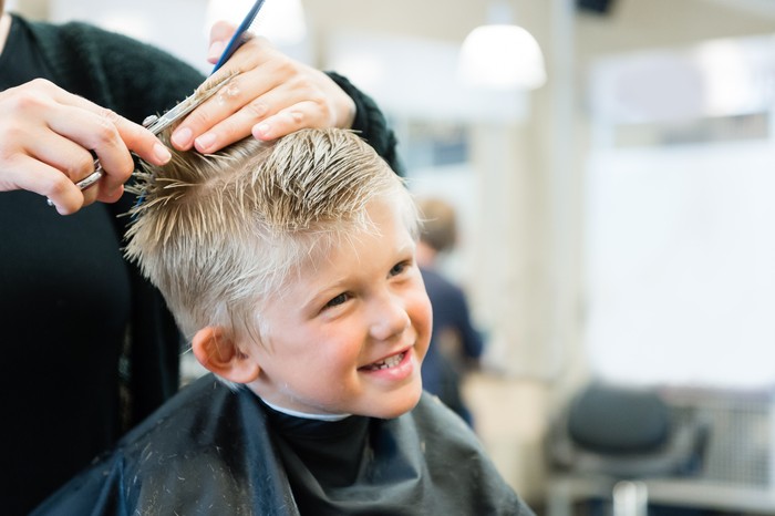 5 Year Old Getting A Haircut at the barber shop.