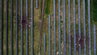 Foto dari udara penampakan lubang besar akibat serangan rudal di pembangkit listrik tenaga surya di wilayah Kharkiv.