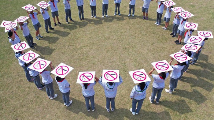 NANJING, CHINA - MAY 31: Students show signs against tobacco and smoking during World No Tobacco Day on May 31, 2022 in Nanjing, Jiangsu Province of China. (Photo by Fang Dongxu/VCG via Getty Images)