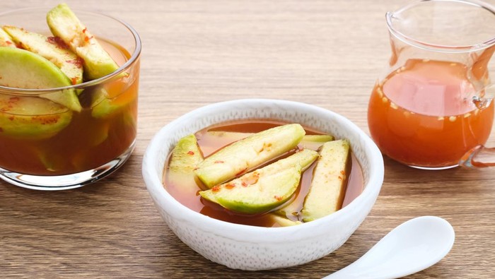 Asinan Kedondong (pickled fruit), a traditional Indonesian cuisine made from preserved tropical fruits. Spicy, sweet and sour taste.