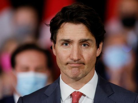 Canada's Prime Minister Justin Trudeau, with government officials and gun-control advocates, speaks at a news conference about firearm-control legislation that was tabled today in the House of Commons in Ottawa, Ontario, Canada May 30, 2022. REUTERS/Blair Gable