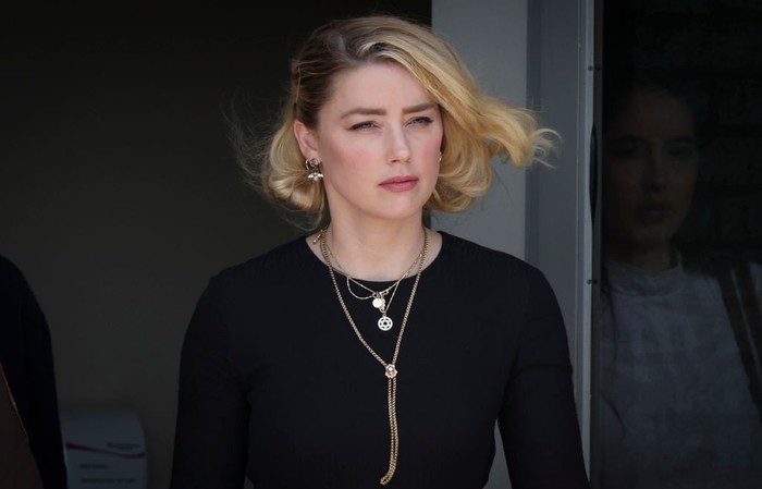 FAIRFAX, VA - JUNE 01: Actress Amber Heard departs the Fairfax County Courthouse on Wednesday, June 1, 2022 in Fairfax, VA. The jury in the Depp vs. Heard case awarded actor Johnny Depp $15 million in his defamation case against Heard. (Kent Nishimura / Los Angeles Times via Getty Images)