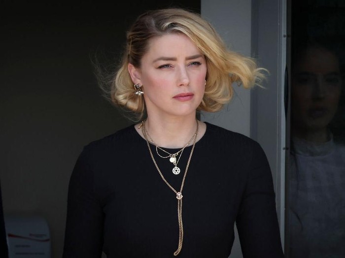 FAIRFAX, VA - JUNE 01: Actress Amber Heard departs the Fairfax County Courthouse on Wednesday, June 1, 2022 in Fairfax, VA. The jury in the Depp vs. Heard case awarded actor Johnny Depp $15 million in his defamation case against Heard. (Kent Nishimura / Los Angeles Times via Getty Images)