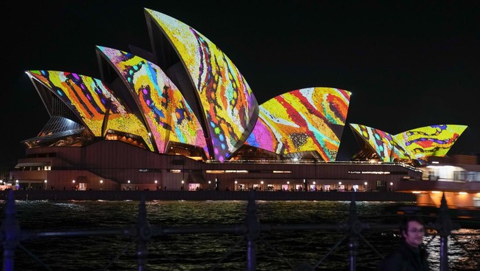 The Sydney Opera House sails are illuminated during the Vivid light show in Sydney, Australia, Thursday, June 2, 2022. The annual festival of light, music and ideas, includes outdoor immersive light installations and projections, performances by local and international musicians, and an ideas exchange forum featuring public talks and debates with leading creative thinkers. (AP Photo/Mark Baker)