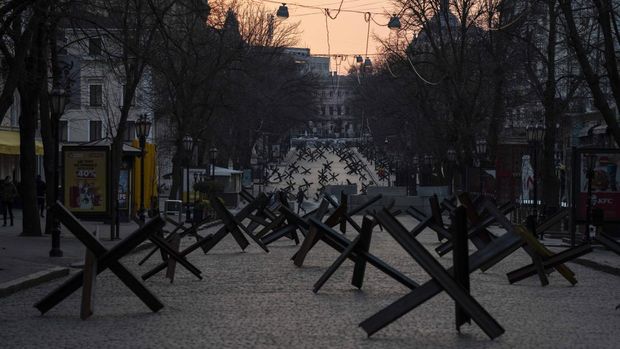 Anti-tank barricades block a street placed in preparation for a possible Russian offensive in Odesa, Ukraine, March 24, 2022. (AP Photo/Petros Giannakouris, File)