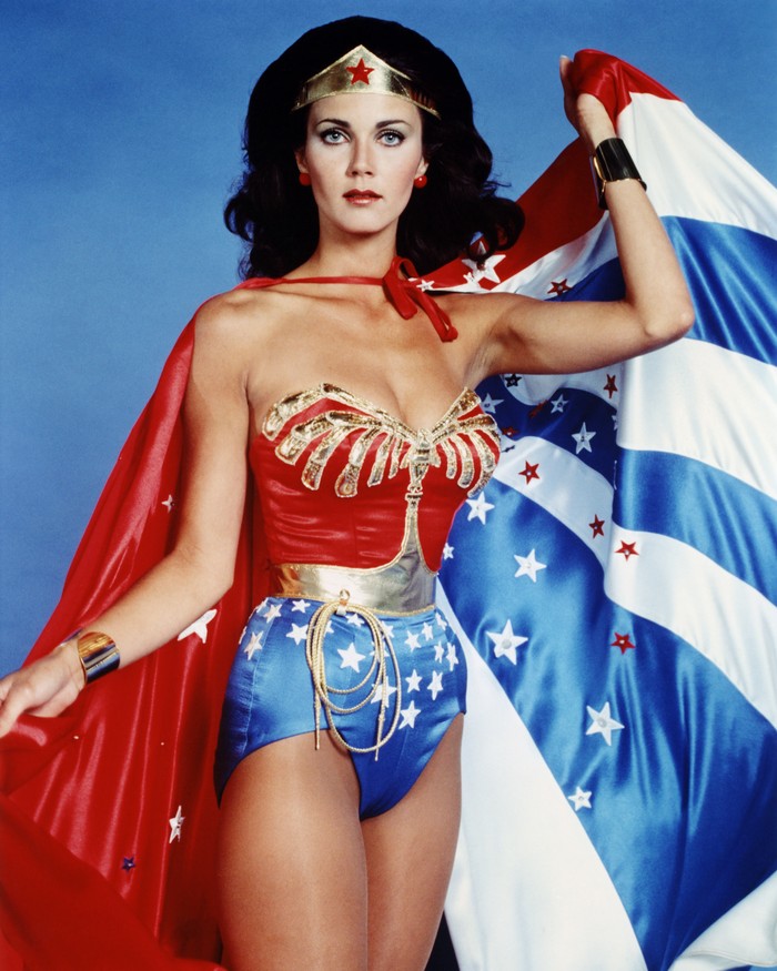 Lynda Carter, US actress, in costume in a studio portrait issued as publicity for the US television series, 'Wonder Woman', USA, circa 1977. The television series, based on the DC Comics character, starred Carter as 'Wonder Woman'. (Photo by Silver Screen Collection/Getty Images)