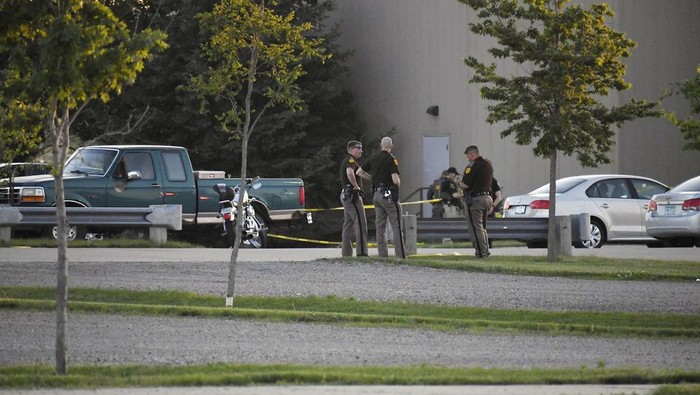 Troopers from the Iowa State Patrol stand outside Cornerstone Church after a shooting on Thursday, June 2, 2022 in Ames, Iowa. Two people and a shooter died Thursday night in a shooting outside a church in Ames, authorities said. (Nirmalendu Majumdar/The Des Moines Register via AP)