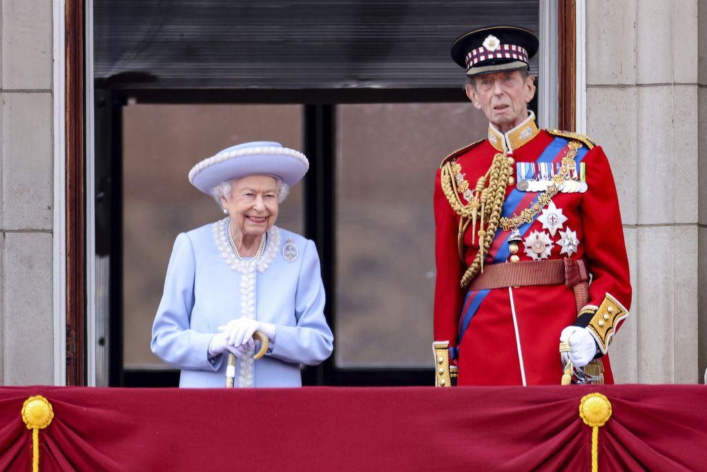 Queen Elizabeth II and the Duke of Kent watch from the balcony of Buckingham Place after the Trooping the Color ceremony in London, Thursday, June 2, 2022, on the first of four days of celebrations to mark the Platinum Jubilee. The events over a long holiday weekend in the U.K. are meant to celebrate the monarch's 70 years of service. (Chris Jackson/Pool via AP)