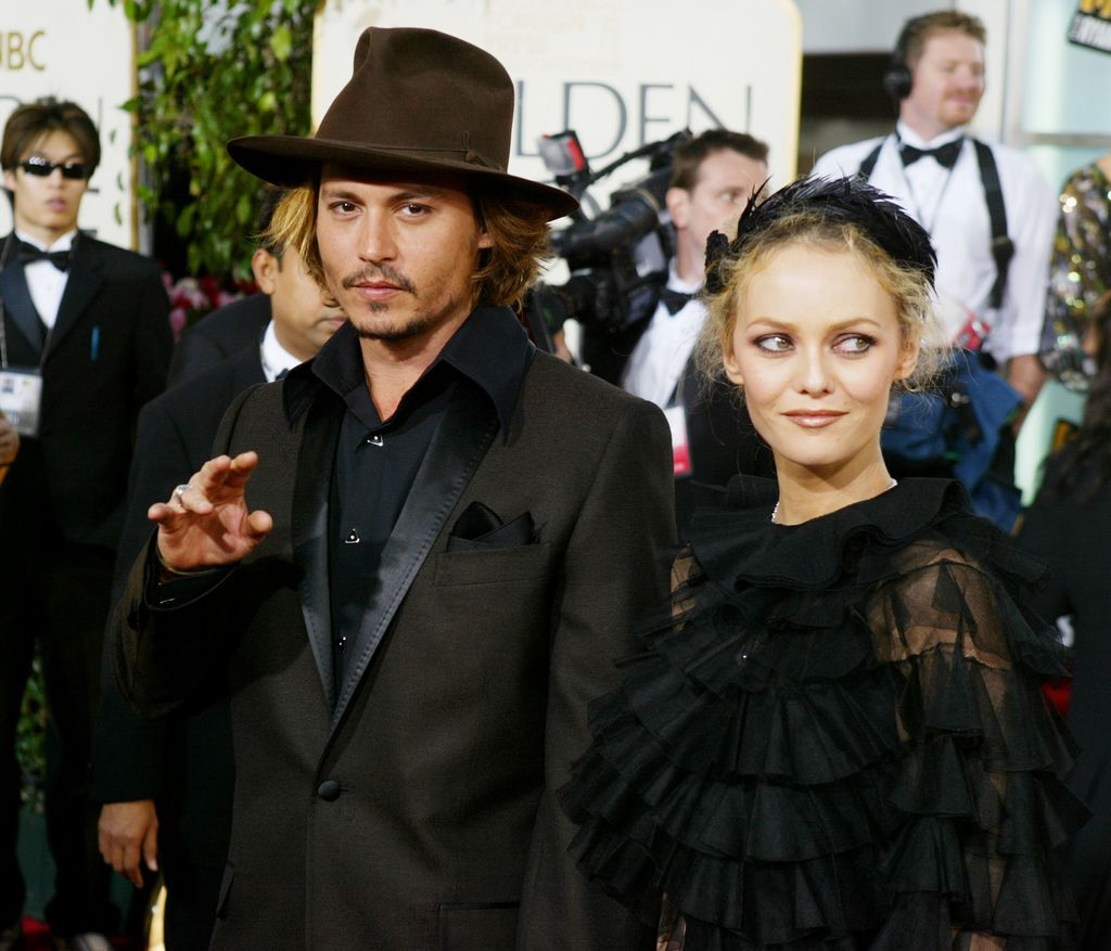 BEVERLY HILLS, CA - JANUARY 25:  Actor Johnny Depp with Vanessa Paradis attend the 61st Annual Golden Globe Awards at the Beverly Hilton Hotel on January 25, 2004 in Beverly Hills, California. (Photo by Carlo Allegri/Getty Images)