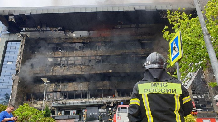 Firefighters extinguish a fire at Grand Setun Plaza business centre in Moscow, Russia June 3, 2022. Moscow News Agency/Handout via REUTERS