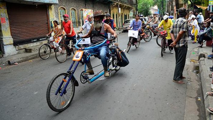 An old man rides his bicycle as he participates in a bicycle rally to observe the World Bicycle Day in Kolkata, India, 03 June, 2022. World Bicycle Day was first marked on June 3, 2018, when the United Nations first adopted a resolution during the 72nd Regular Session of the United Nations General Assembly in New York City in April. World Bicycle Day becomes all the more significant with the growing concerns around the lack of physical activities among people and its health hazards. A cycle is a clean, affordable, and environment-friendly mode of transportation and promoting its use contributes to the conservation of nature and achieving cleaner air and environment.  (Photo by Indranil Aditya/NurPhoto via Getty Images)