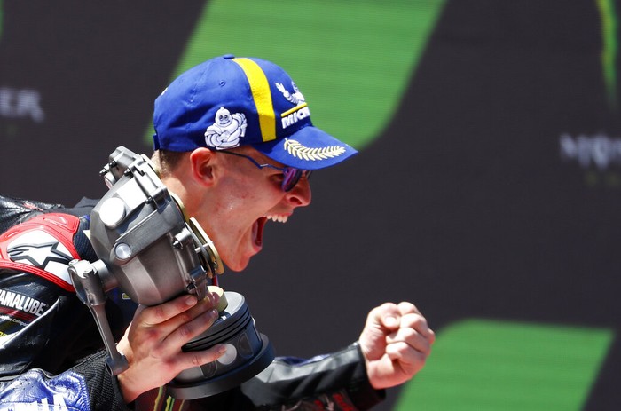 Frances rider Fabio Quartararo of the Monster Energy Yamaha MotoGP celebrates his victory in the MotoGP race of the Catalunya Motorcycle Grand Prix at the Catalunya racetrack in Montmelo, just outside of Barcelona, Spain, Sunday, June 5, 2022. (AP Photo/Joan Monfort)