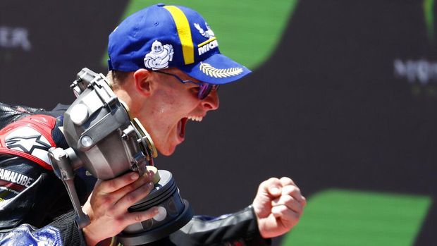 France's rider Fabio Quartararo of the Monster Energy Yamaha MotoGP celebrates his victory in the MotoGP race of the Catalunya Motorcycle Grand Prix at the Catalunya racetrack in Montmelo, just outside of Barcelona, Spain, Sunday, June 5, 2022. (AP Photo/Joan Monfort)