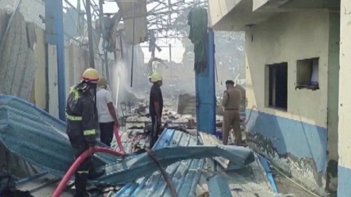 Firefighters douse fire after an explosion at a damaged factory in Hapur, Uttar Pradesh, India, June 4, 2022, in this still image obtained from a handout video. ANI/Handout via REUTERS THIS IMAGE HAS BEEN SUPPLIED BY A THIRD PARTY. INDIA OUT. NO COMMERCIAL OR EDITORIAL SALES IN INDIA. NO RESALES. NO ARCHIVES
