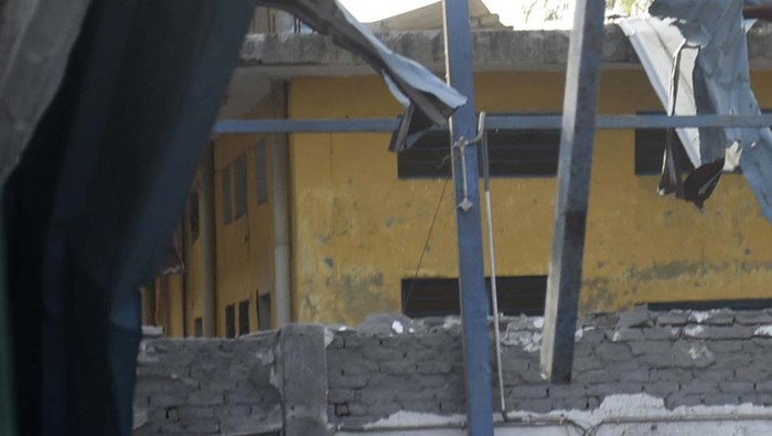 Policemen inspect the site of a fire in Hapur, India, Saturday, June 4, 2022. At least eight workers were killed and more than a dozen others injured after fire erupted in a chemical factory in northern India, police said Saturday. (AP Photo)