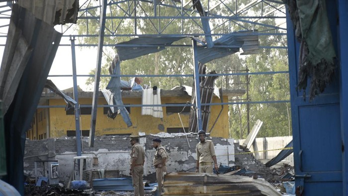 India Fire Policemen inspect the site of a fire in Hapur, India, Saturday, June 4, 2022. At least eight workers were killed and more than a dozen others injured after fire erupted in a chemical factory in northern India, police said Saturday. (AP Photo)