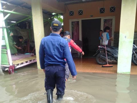 Banjir merendam ribuan rumah warga yang berada di Kecamatan Teluknaga, Kabupaten Tangerang, Banten. Banjir ini disebabkan Kali Cisadane meluap. (dok BPBD Kabupaten Tangerang)